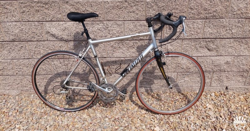 Silver frame Specialized Sequoia Expert leaning against wall